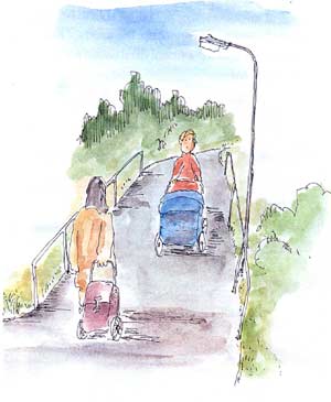obrazek: po drodze idzie kobieta z wózkiem dziecięcym i wózkiem - plecakiem spożywczym